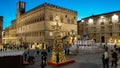 Medieval main square of Perugia with christmas tree at twilight in Umbria