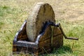 Medieval manual grinding wheel. Royalty Free Stock Photo