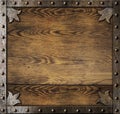 Medieval metal frame over old wooden background Royalty Free Stock Photo