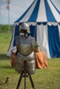 Medieval Metallic Armor and Ancient Tent in background