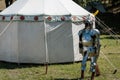 Medieval Metallic Armor with Helmet near White Tent