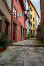 Medieval narrow street with colorful buildings in old town of Porto, Portugal with nobody. Medieval architecture of Royalty Free Stock Photo