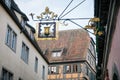 Medieval narrow street, colorful renaissance, gothic historical buildings, vintage wrought iron signs, half-timbered houses, old