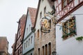 Medieval narrow street, renaissance, gothic historical buildings, vintage wrought iron signs, half-timbered houses, old town hotel