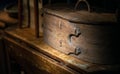 Medieval old wooden chest on vintage table in rustic cottage interior Royalty Free Stock Photo