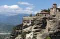 The medieval Orthodox monastery is located on top of cliffs among picturesque mountains in the distance stretches the valley with