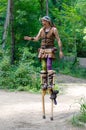 Medieval performer on stilts
