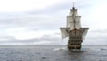 A medieval pirate ship sailing on a vast blue ocean. Concept of sea adventures in the middle ages. 3D Rendering Royalty Free Stock Photo