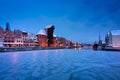 Medieval port crane in Gdansk at Motlawa river in snowy winter, Poland