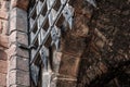 Medieval portcullis gate seen in the opened position at the entrance to a historic building