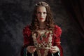 medieval queen in red dress with crown Royalty Free Stock Photo