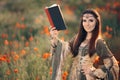 Medieval Reading a Book in a Magical Field of Poppies Royalty Free Stock Photo