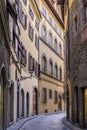 Gothic buildings on a narrow street in Centro Storico of Florence, Italy