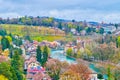 Medieval residential houses on the bank of Aare river in surrounding of lush grenery in Bern, Switzerland