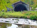 Functioning old watermill on the river with lots of greenery Royalty Free Stock Photo