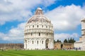 Pisa, Italy - May 24, 2018: Medieval Romanesque Pisa Baptistery of St. John Battistero di San Giovanni at Piazza dei Miracoli