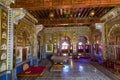 Royal City Palace Jaipur interior view of glass room with mirror and gold artwork at Rajasthan, India