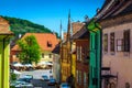 Medieval saxon street with cafe bar in Sighisoara, Transylvania, Romania Royalty Free Stock Photo