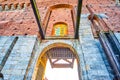 Sforza\'s Castle with lifting mechanism of the drawbridge and Coat of Arms above Porta del Carmini gate, Milan, Italy