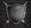 Medieval shield with crossed swords on brick wall 3d illustration Royalty Free Stock Photo