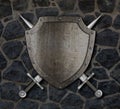 Medieval shield and crossed swords on wall