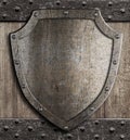 Medieval shield on wooden gate