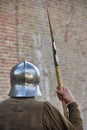 Medieval soldier under the castle walls