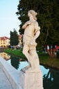 Medieval statue and river in Castelfranco Veneto, Treviso, Italy Royalty Free Stock Photo