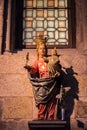 Medieval statue of Saint Jacob at the church facade. Symbol of pilgrimage and travel. Monument of catholic saint James.