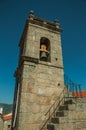 Medieval steeple made of stone with bell and staircase