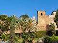 Medieval stone arches and walkway by the walls and towers of an ancient Alcazaba fortress in Malaga