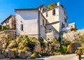 Medieval stone defense tower house at Rue Barque en Cannes street in historic old town of Antibes resort city in France