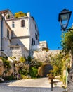 Medieval stone defense tower house at Rue Barque en Cannes street in historic old town of Antibes resort city in France