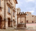 The medieval stone well Pozzo dei Grifi e dei Leoni with griffins and lions on the central Piazza Grande in Montepulciano, Royalty Free Stock Photo