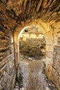 Medieval stony portal with wall wall in background