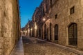 Medieval Street of the Knights called Ippoton with cobblestone road in Old town of Rhodes city in Rhodes island, Greece Royalty Free Stock Photo