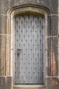 A medieval style door in a stone doorway