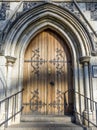 Medieval style European wooden door from an arch entrance