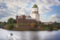 Medieval swedish castle with St Olaf tower in Vyborg and cutter at foreground