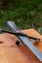 Medieval sword on wood. Royalty Free Stock Photo