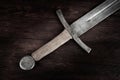 Medieval sword on wooden backgrond Royalty Free Stock Photo