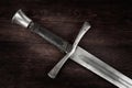 Medieval sword on wooden backgrond Royalty Free Stock Photo