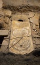 Medieval tombstone or slab of an ancient tomb with Roman inscriptions from the early Christian crypt in the basement of the church