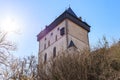 Medieval tower against a clear sky surrounded by winter trees Royalty Free Stock Photo