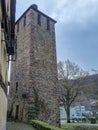 Medieval stone tower with preserved historic architecture in European village Royalty Free Stock Photo