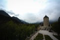 Medieval Tower and Courtyard over Austrian Mountain Landscape with Overcast Royalty Free Stock Photo