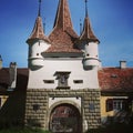 Medieval tower gate with coat of arms