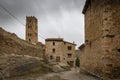 Medieval tower and old houses in Villarroya de los Pinares Royalty Free Stock Photo