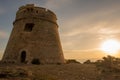 Medieval tower of Sal Rossa at sunrise in Ibiza