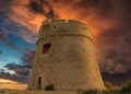 Medieval tower of Sal Rossa at sunrise in Ibiza